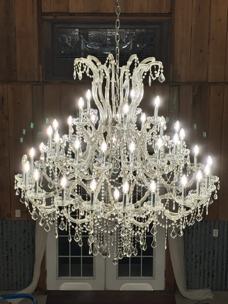 Close view of the antique crystal chandelier inside the barn