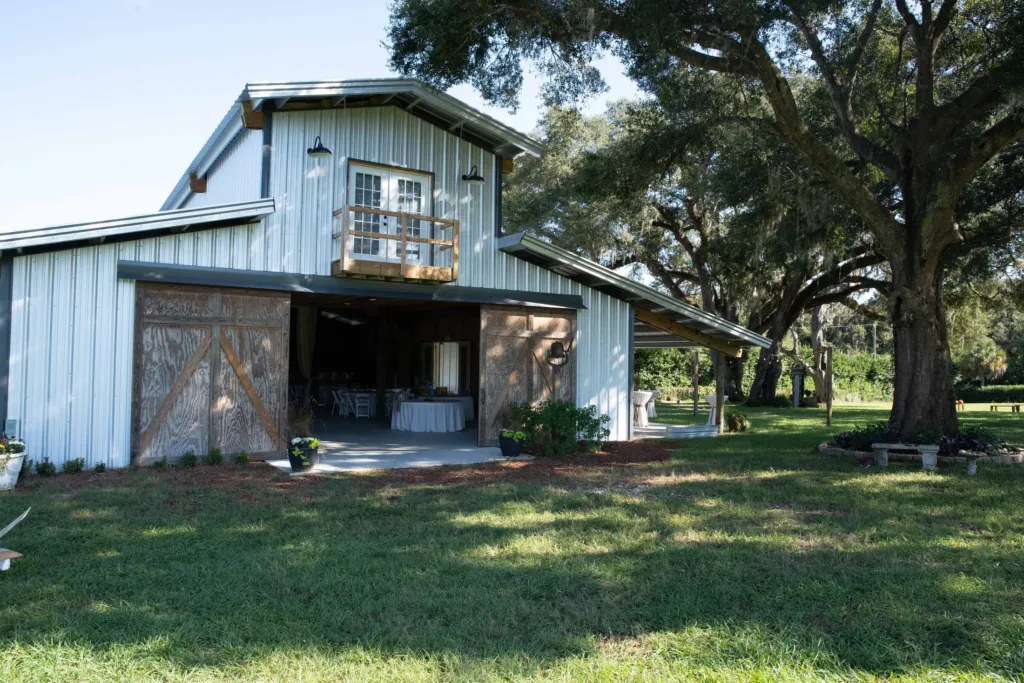 The barn's loft balcony with oaks to either side