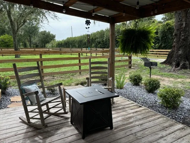 Rocking chairs and a fire table on the Cowboy Cabin porch