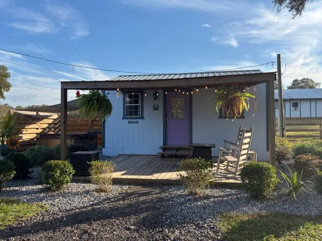 Peace Cottage with its front porch and pergola