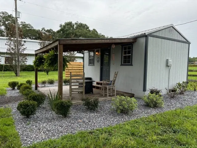 Side view of Peace Cottage with landscaped gravel beds
